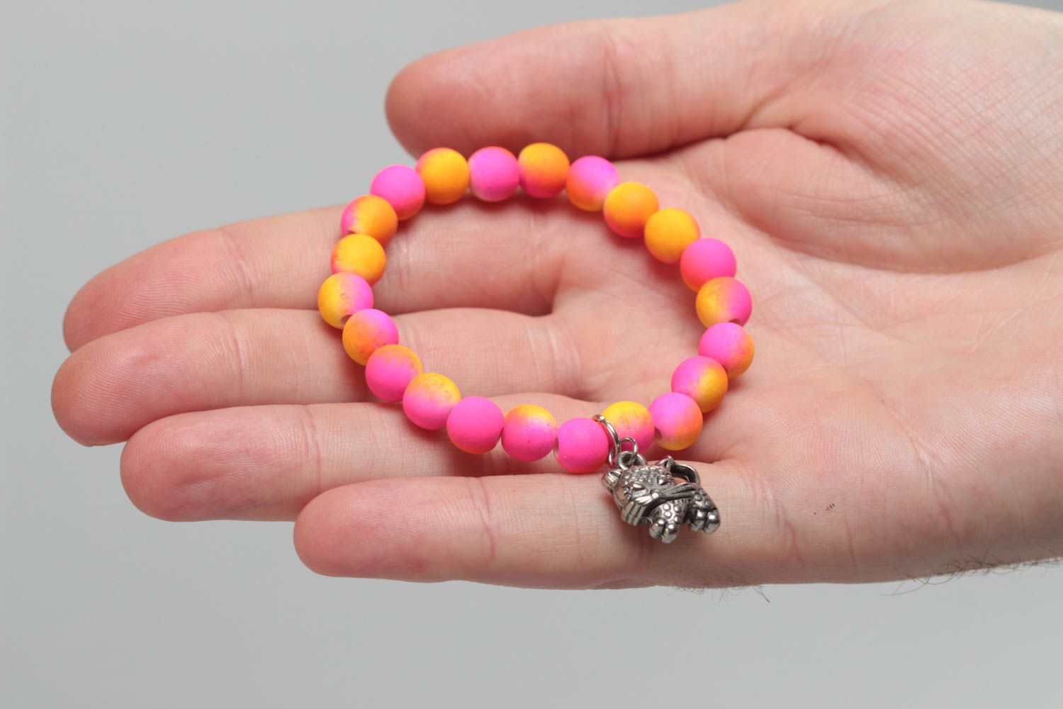 Bright pink handmade children's plastic bead bracelet with charm photo 5