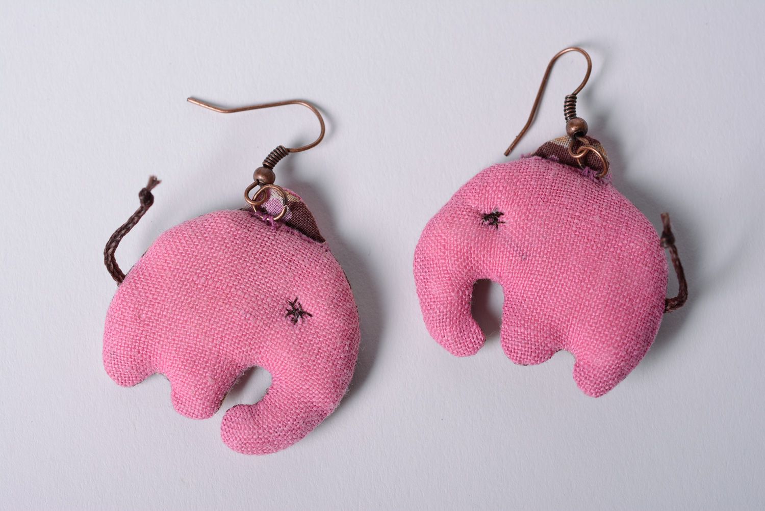 Handmade designer dangle earrings sewn of fabric elephants in pink color palette photo 4
