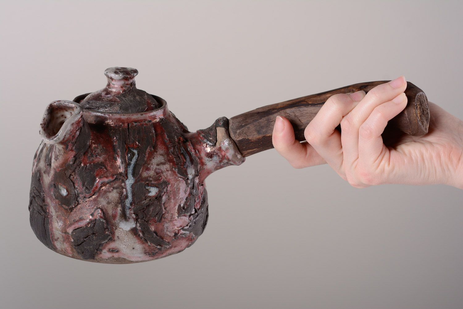Handmade ethnic ceramic teapot fired with limited aeration with wooden handle photo 4