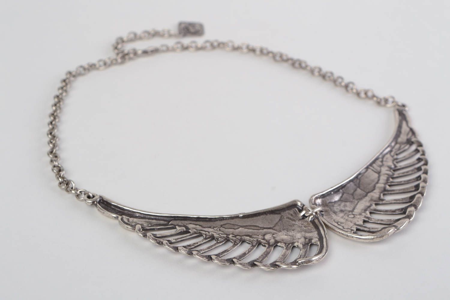 Unusual handmade metal lace necklace with wings of silvery color photo 4