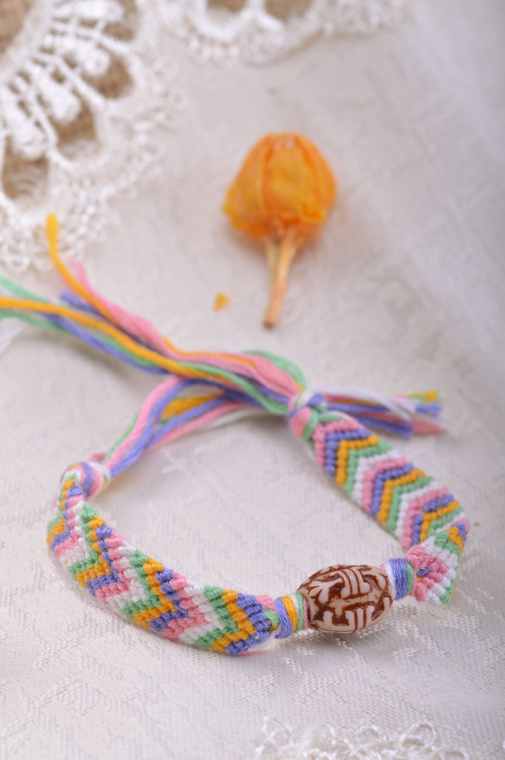 Simple handmade friendship bracelet woven of colorful embroidery floss with beads photo 5