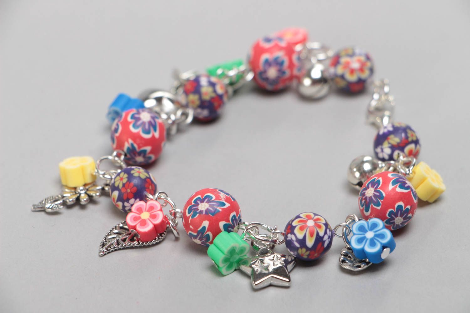 Bright handmade children's polymer clay wrist bracelet with beads and charms photo 2