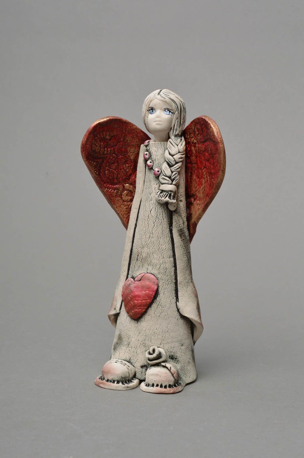 Handmade decorative souvenir statuette made of porcelain Angel with plait photo 1