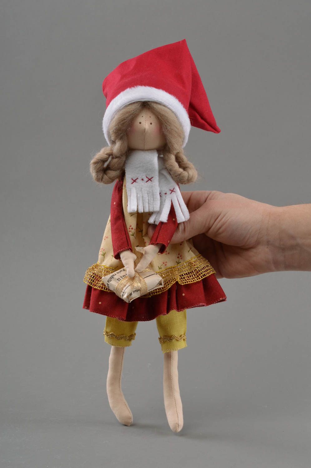 Handmade small toy doll made of fabric in New Year dress with surprise photo 1