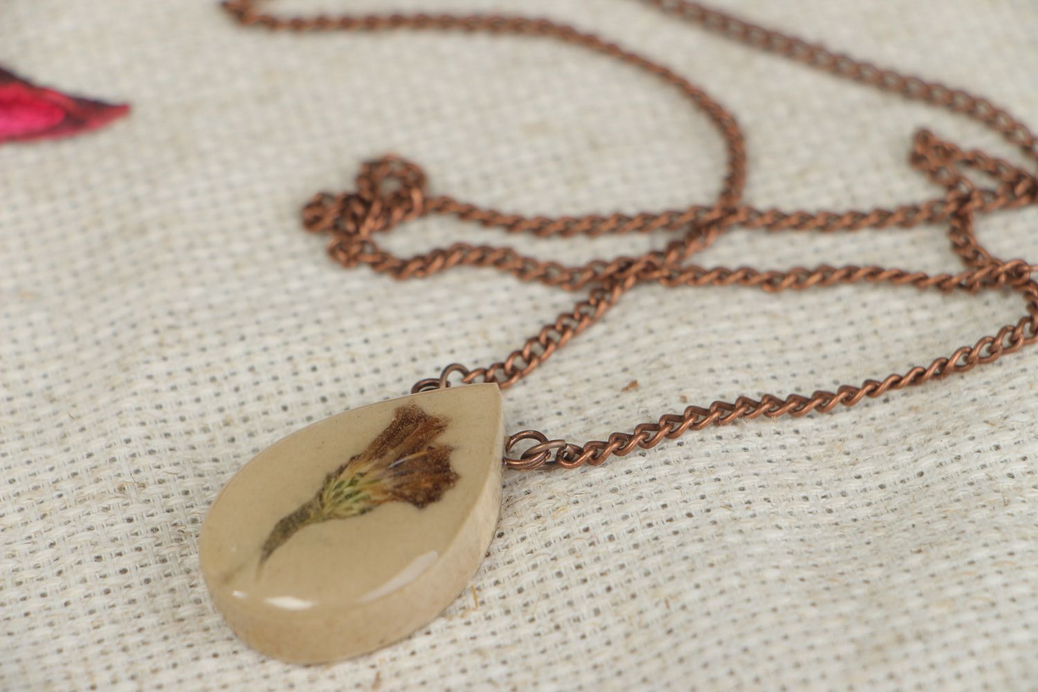 Handmade drop shaped pendant with flowers in epoxy resin on long chain Burdock photo 5