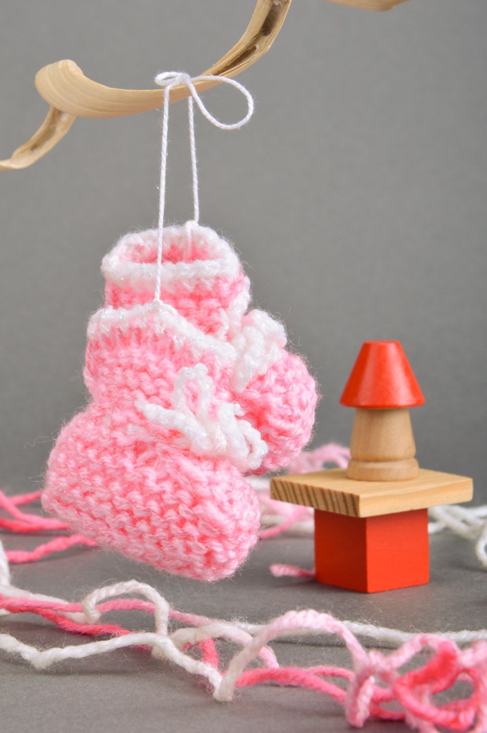 Handmade decorative wall hanging baby shoes knitted of semi-woolen pink threads photo 1