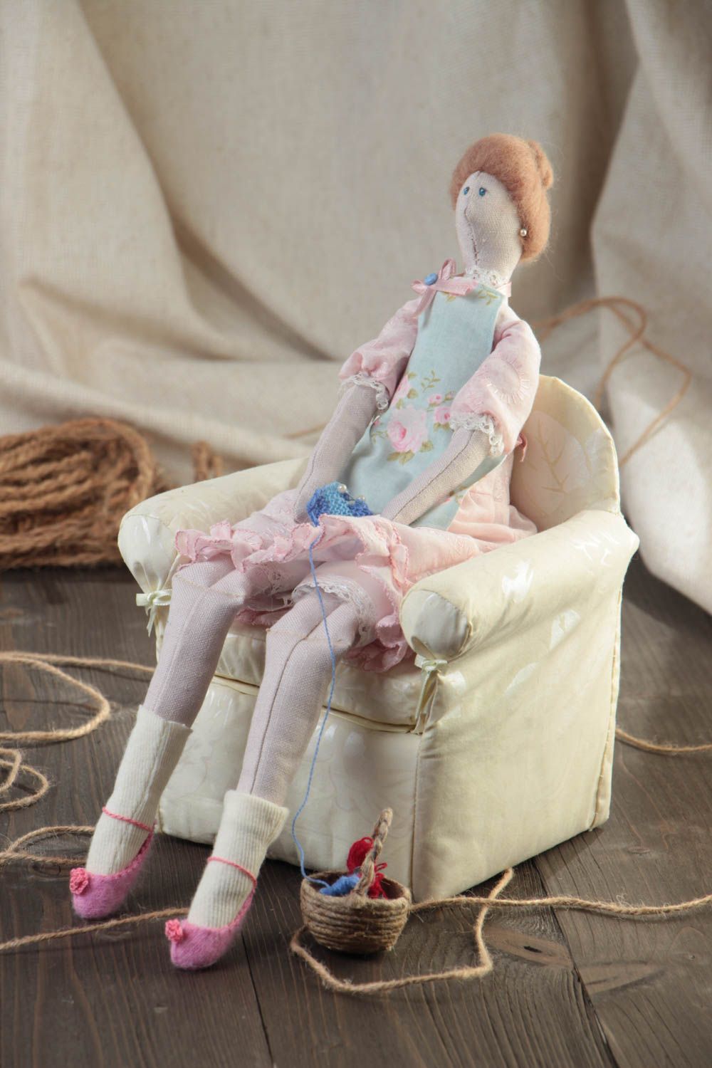 Handmade designer cotton fabric soft doll sitting in arm chair and knitting photo 1