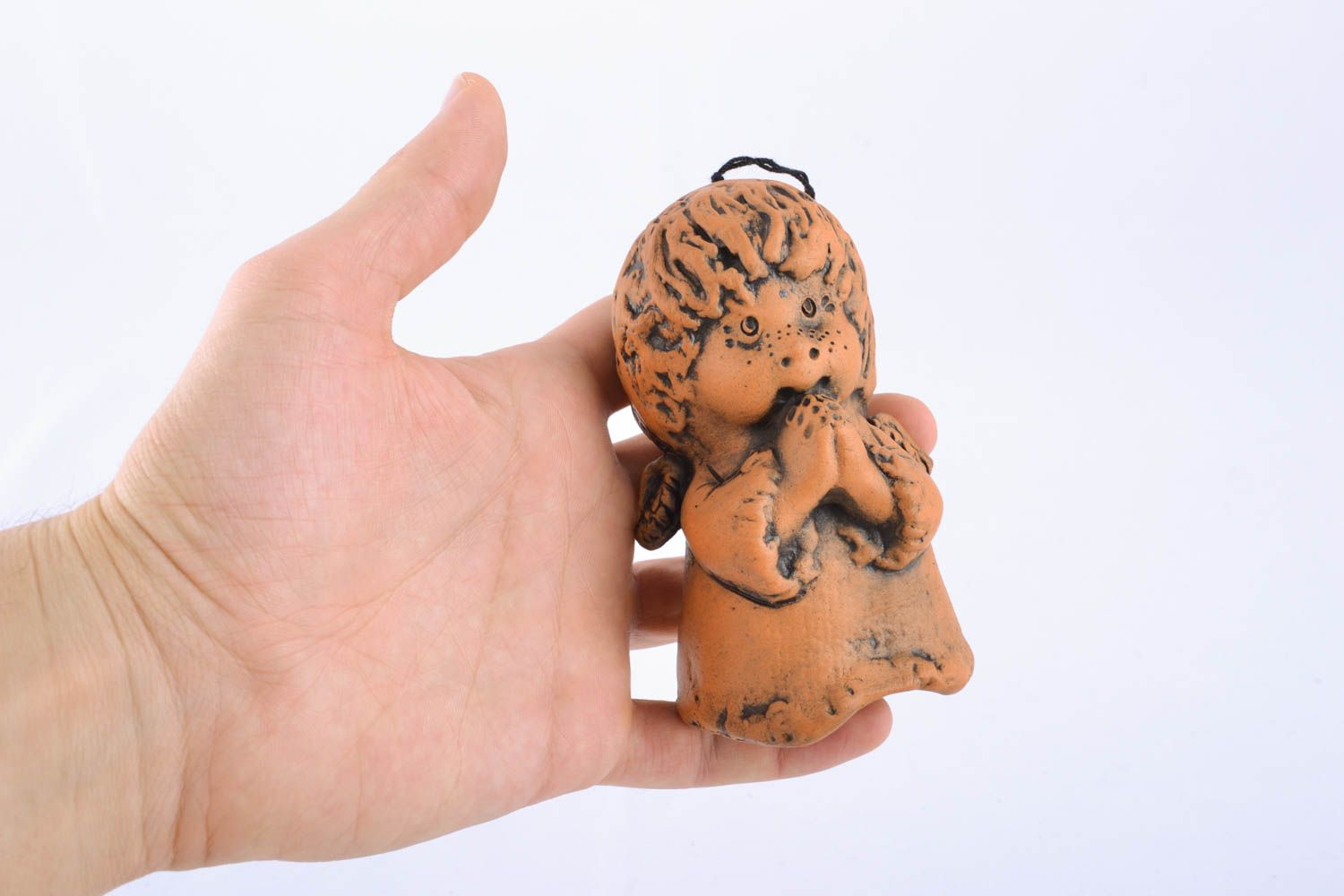 Campanilla cerámica artesanal con forma de niño foto 4