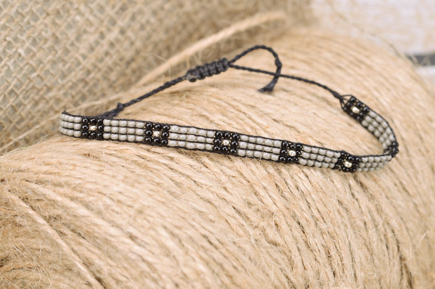 Beautiful black and gray thin beaded bracelet with ties for men photo 1