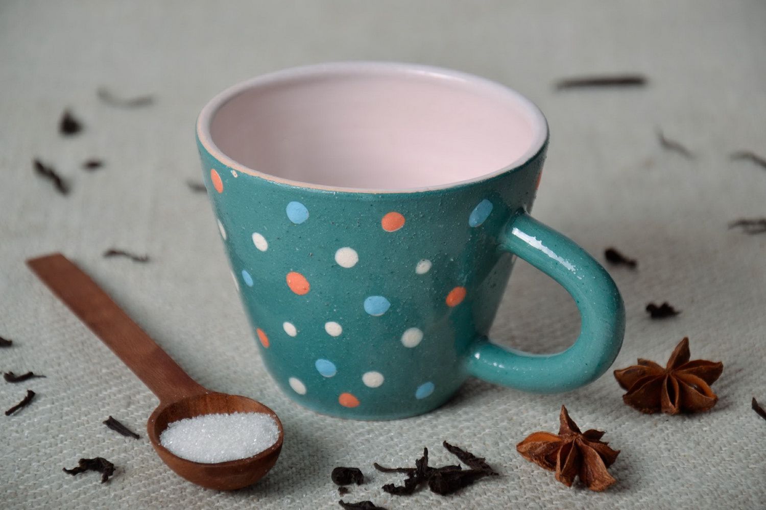 Turquoise porcelain cup with multi-colored dots photo 1