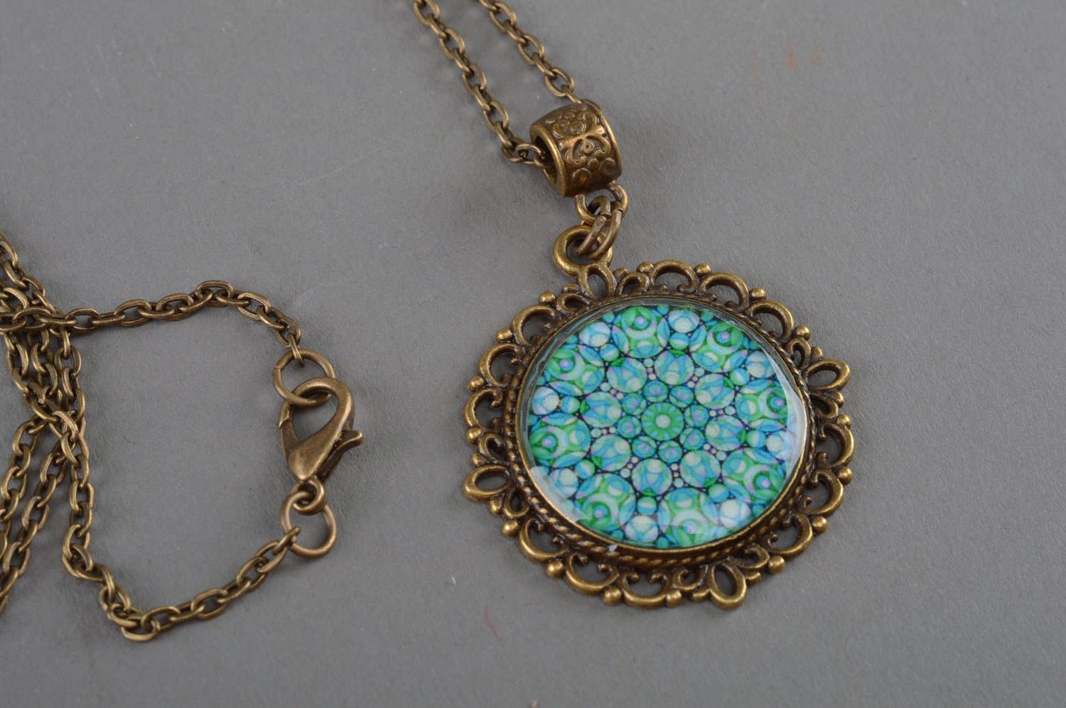 Epoxy-coated round handmade blue pendant with flower print stylish accessory photo 2