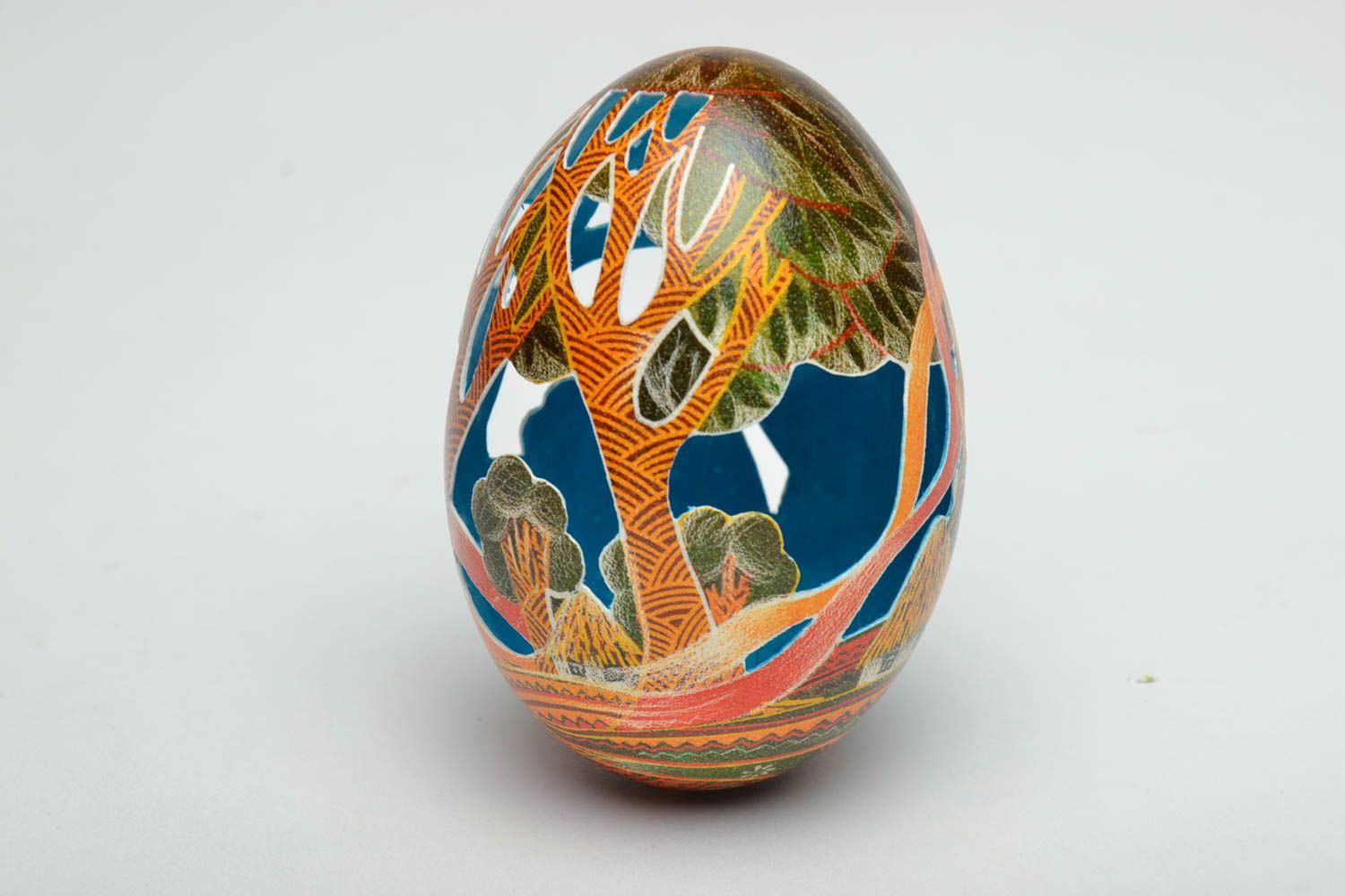Easter egg painted with aniline dyes and decorated using carving technique photo 4