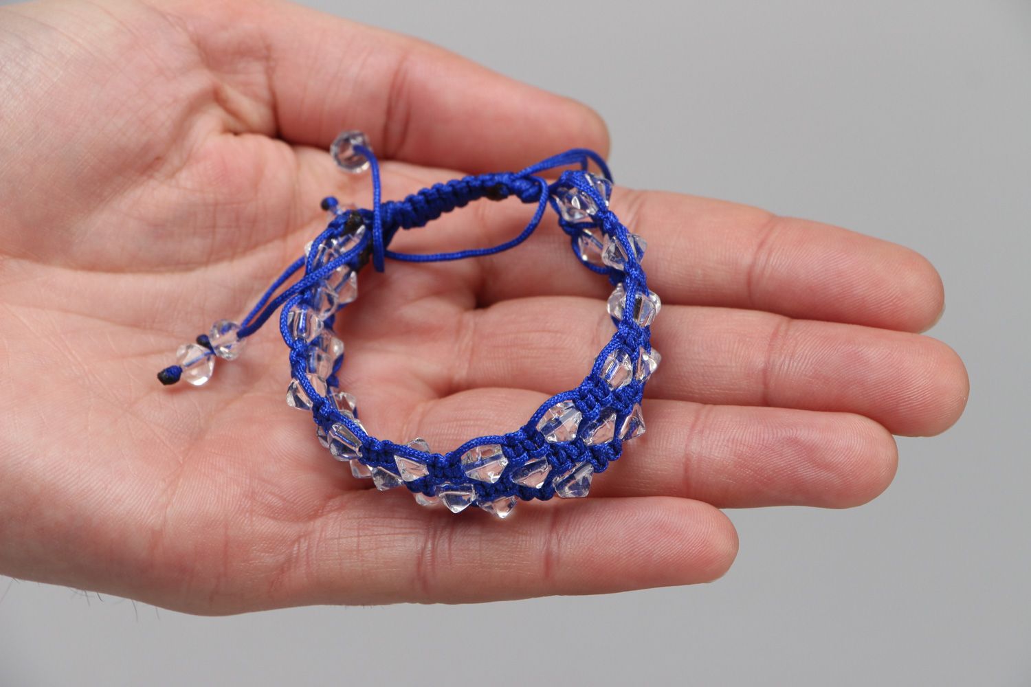 Handmade blue friendship bracelet with synthetic thread and faceted glass beads photo 3