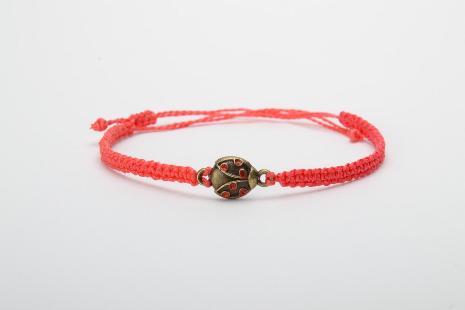 Handmade women's macrame woven cord bracelet of red color with charm photo 5