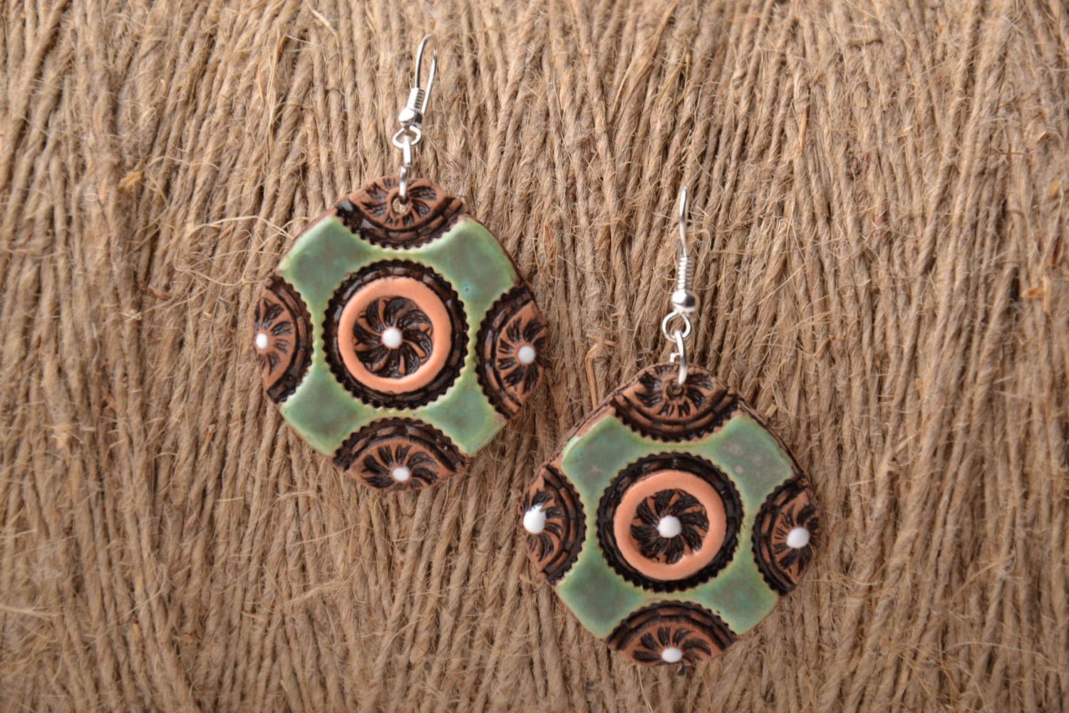 Ceramic earrings with ornament photo 1