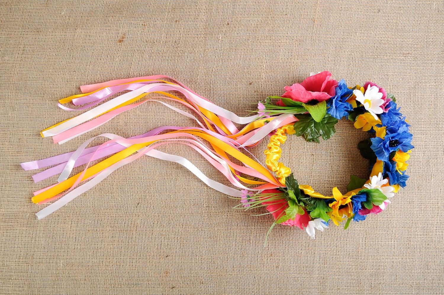 Ethnic wreath made of artificial flowers photo 1
