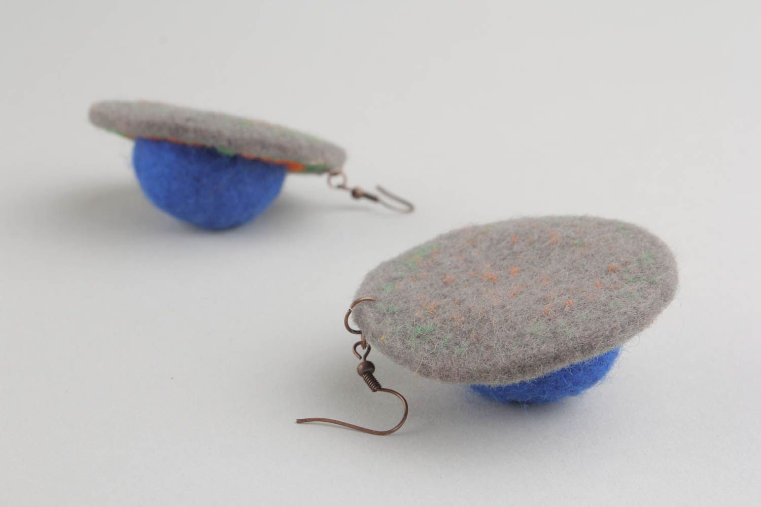 Round earrings made of wool and felt using felting technique photo 4