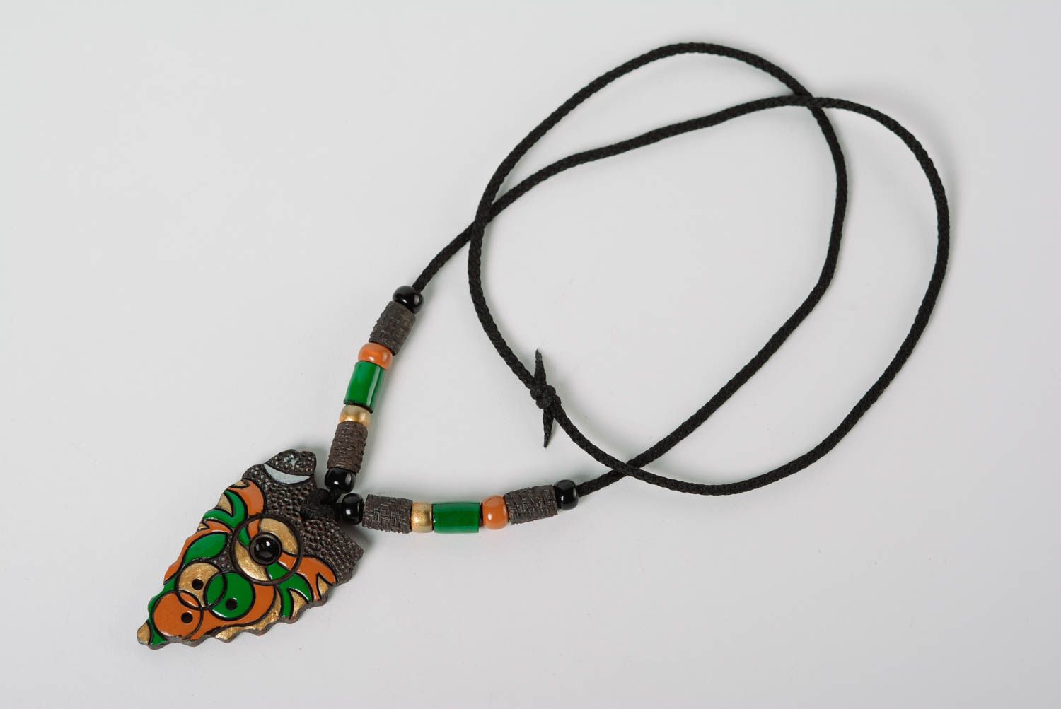 Interesting handmade designer clay pendant painted with color enamel on cord photo 1