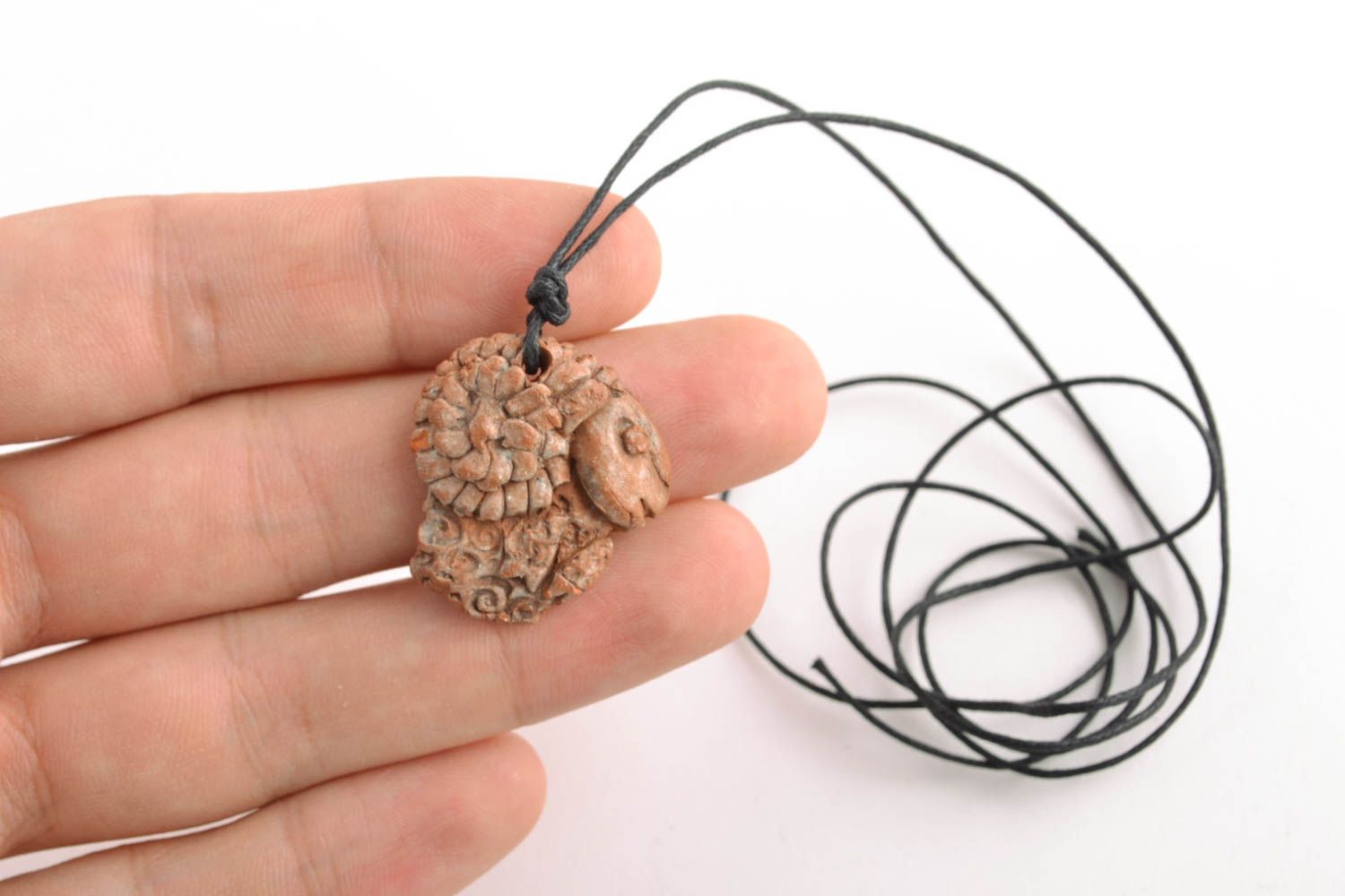 Ethnic clay pendant with cord photo 2