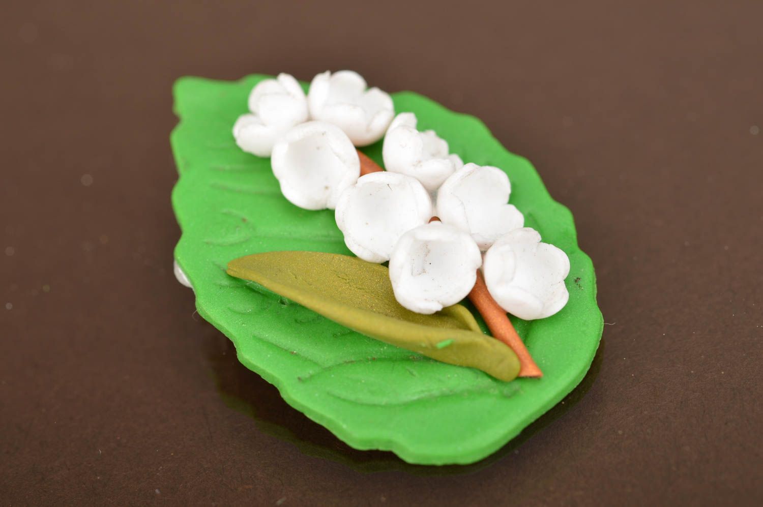 Handmade brooch made of polymer clay in shape of green leaf with wood lilies photo 5