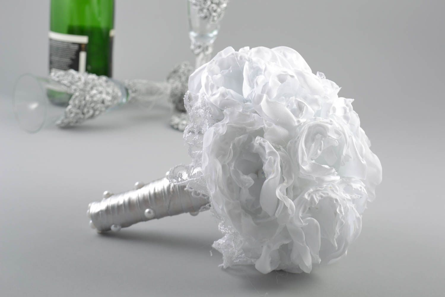 Designer beautiful white wedding bouquet made of satin ribbons and fabric photo 1