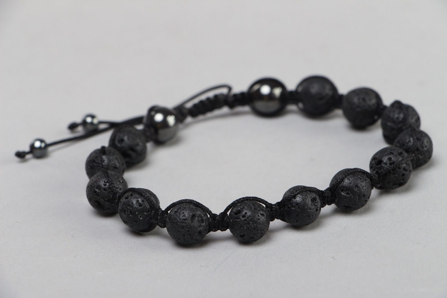 Handmade wrist bracelet with volcanic lava and hematite beads with adjustable size photo 1