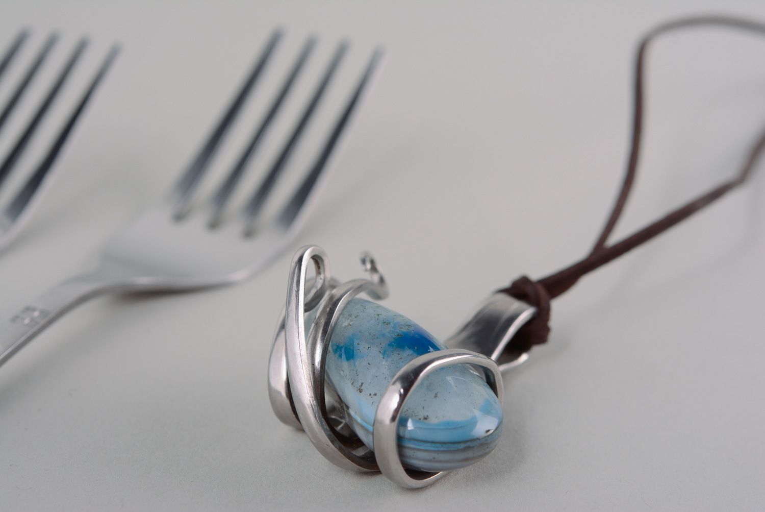 Homemade metal pendant made of cupronickel fork with blue stone photo 1
