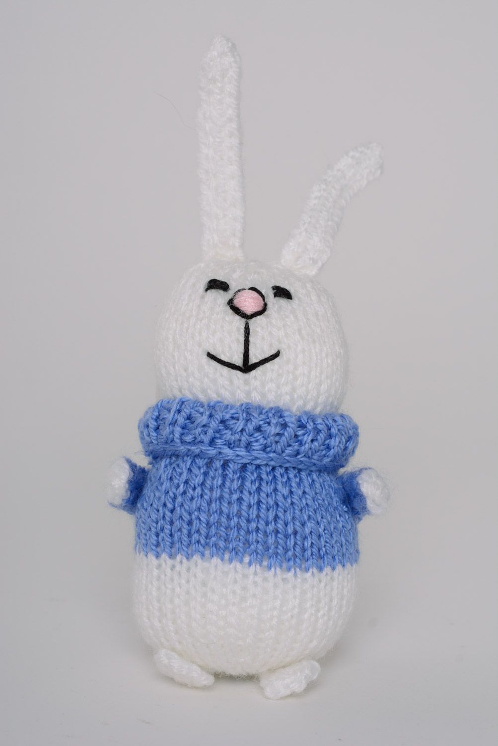 Handmade knitted soft toy smiling white bunny in blue sweater photo 1