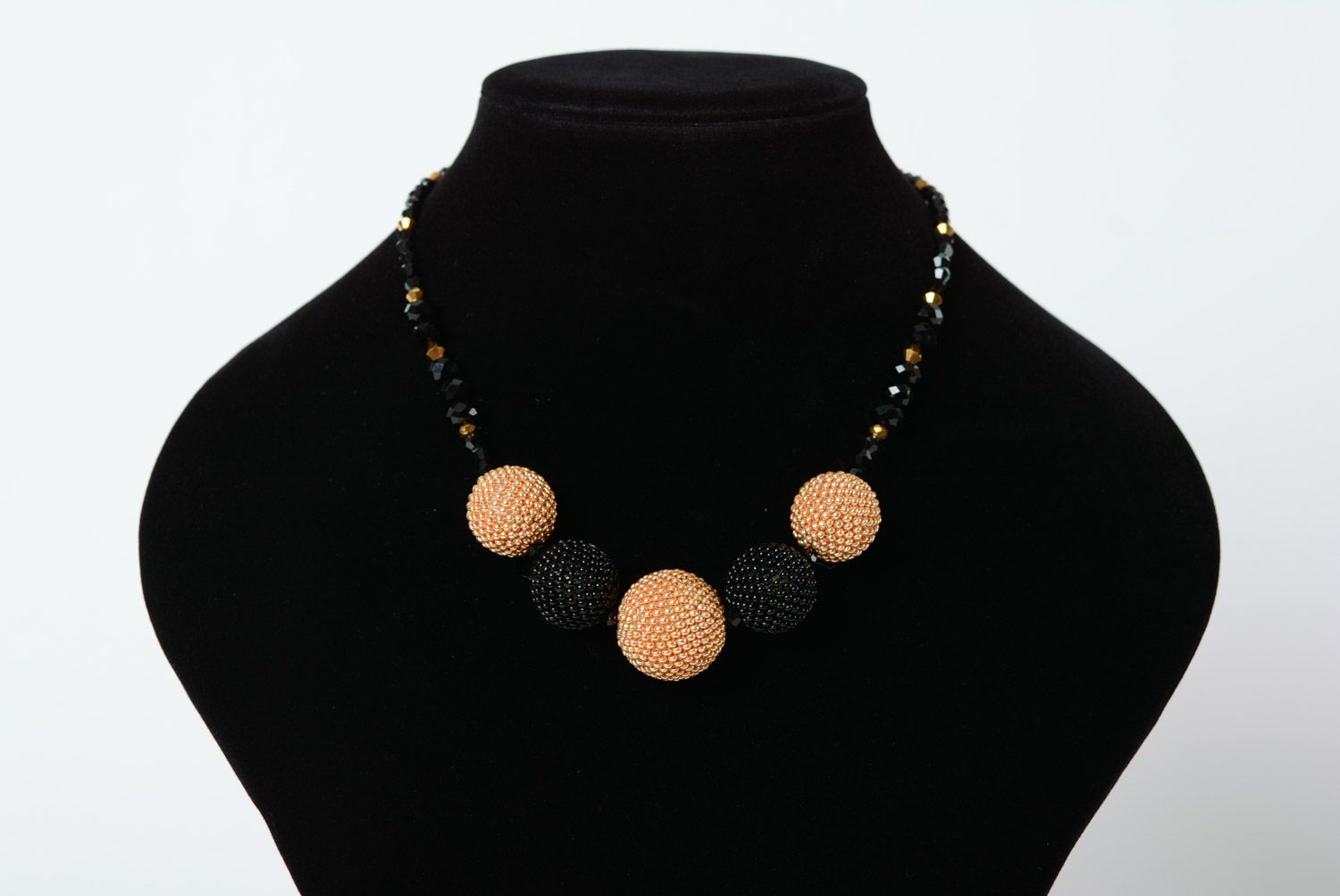 Elegant necklace with balls woven over with beige and black beads for women photo 1