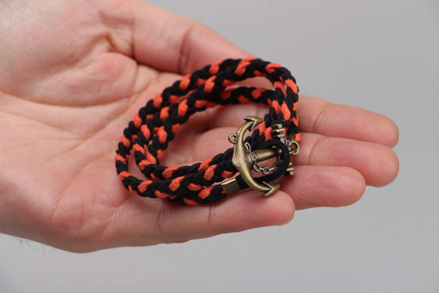 Handmade marine bracelet woven of faux suede cord of black and orange colors photo 3