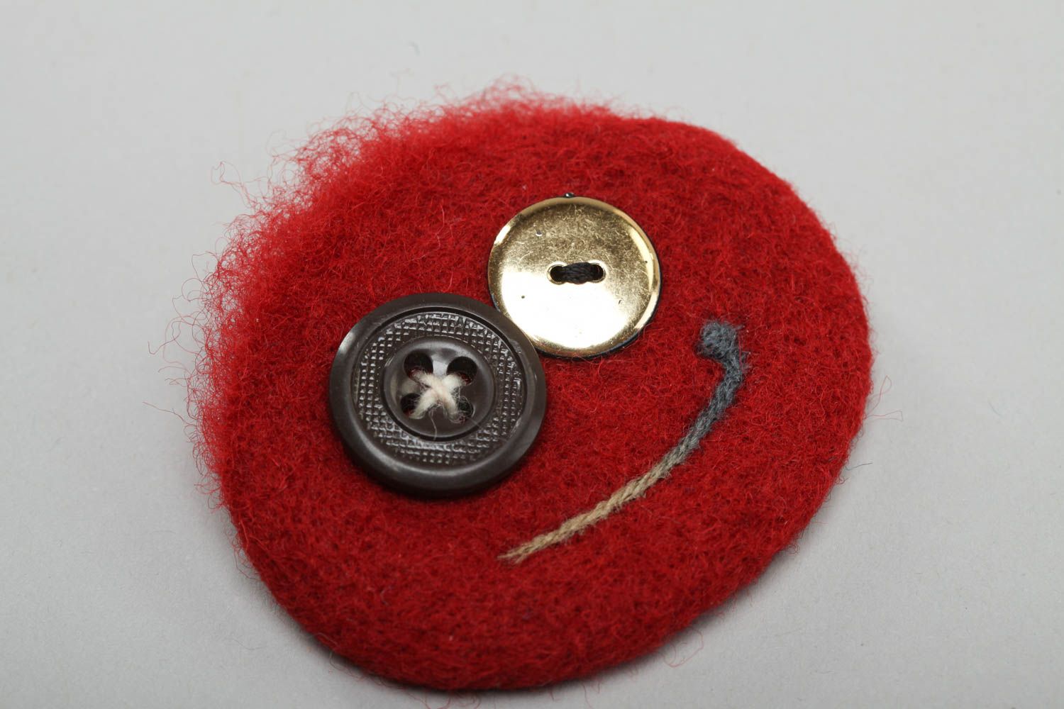 Brooch made of felted wool funny red round accessory with buttons hand made photo 2