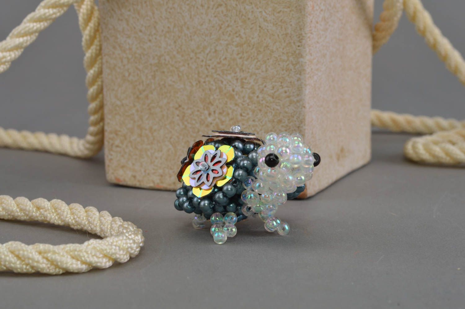 Beautiful small handmade designer figurine of turtle woven of beads for decor photo 1