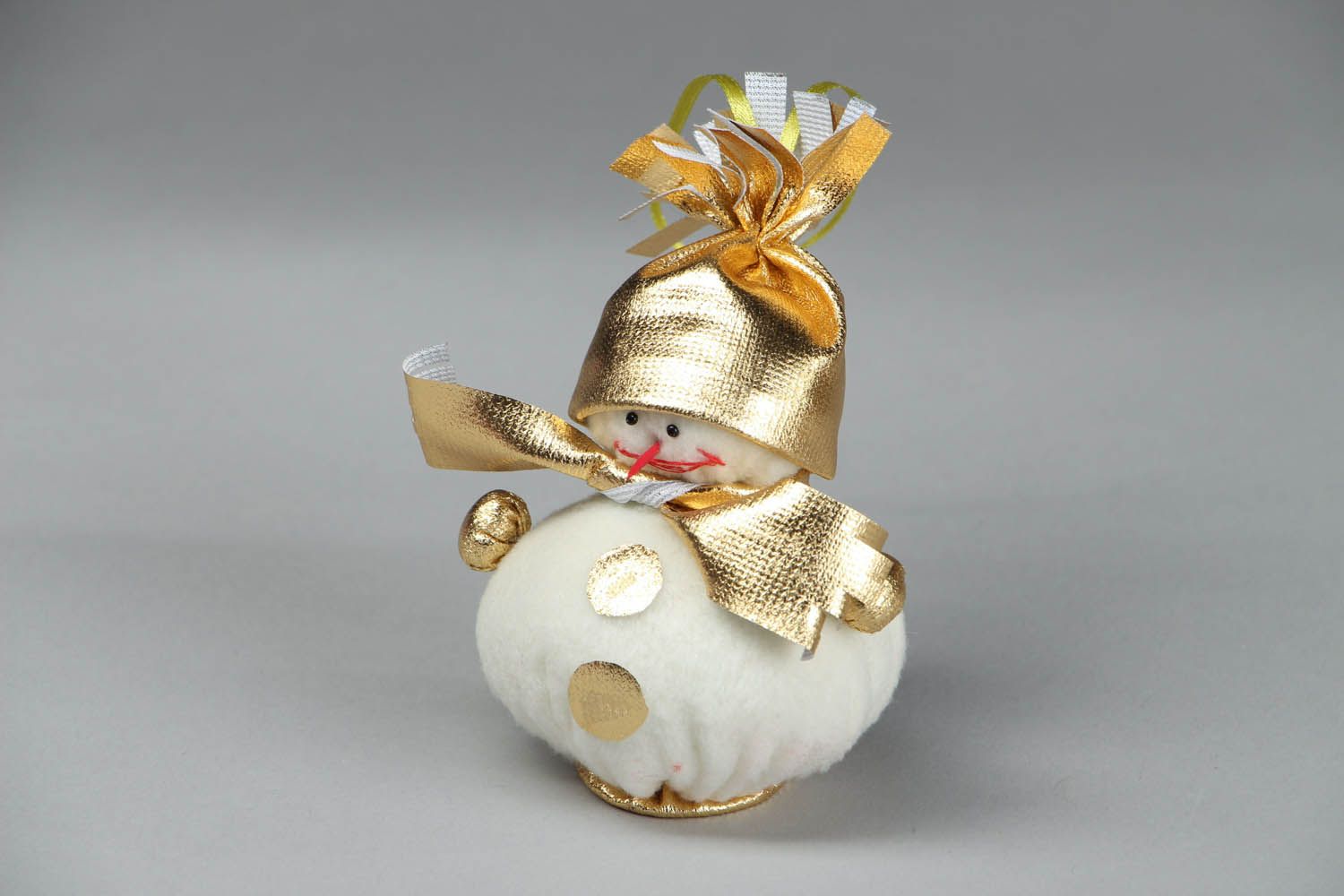 Snowman of beige and golden color photo 1