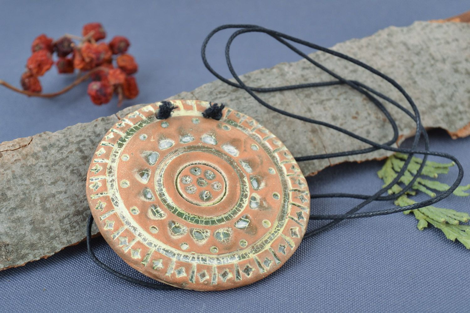 Handmade large light ceramic pendant of round shape with ethnic ornaments  photo 1
