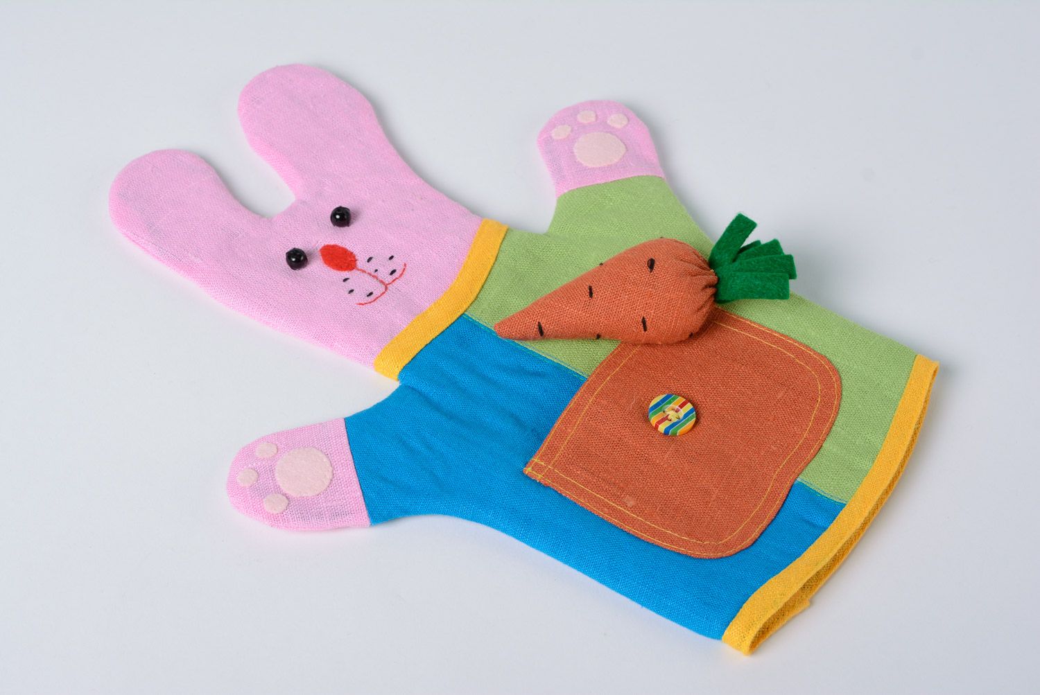 Bright colorful handmade hand puppet sewn of fabric pink rabbit photo 3