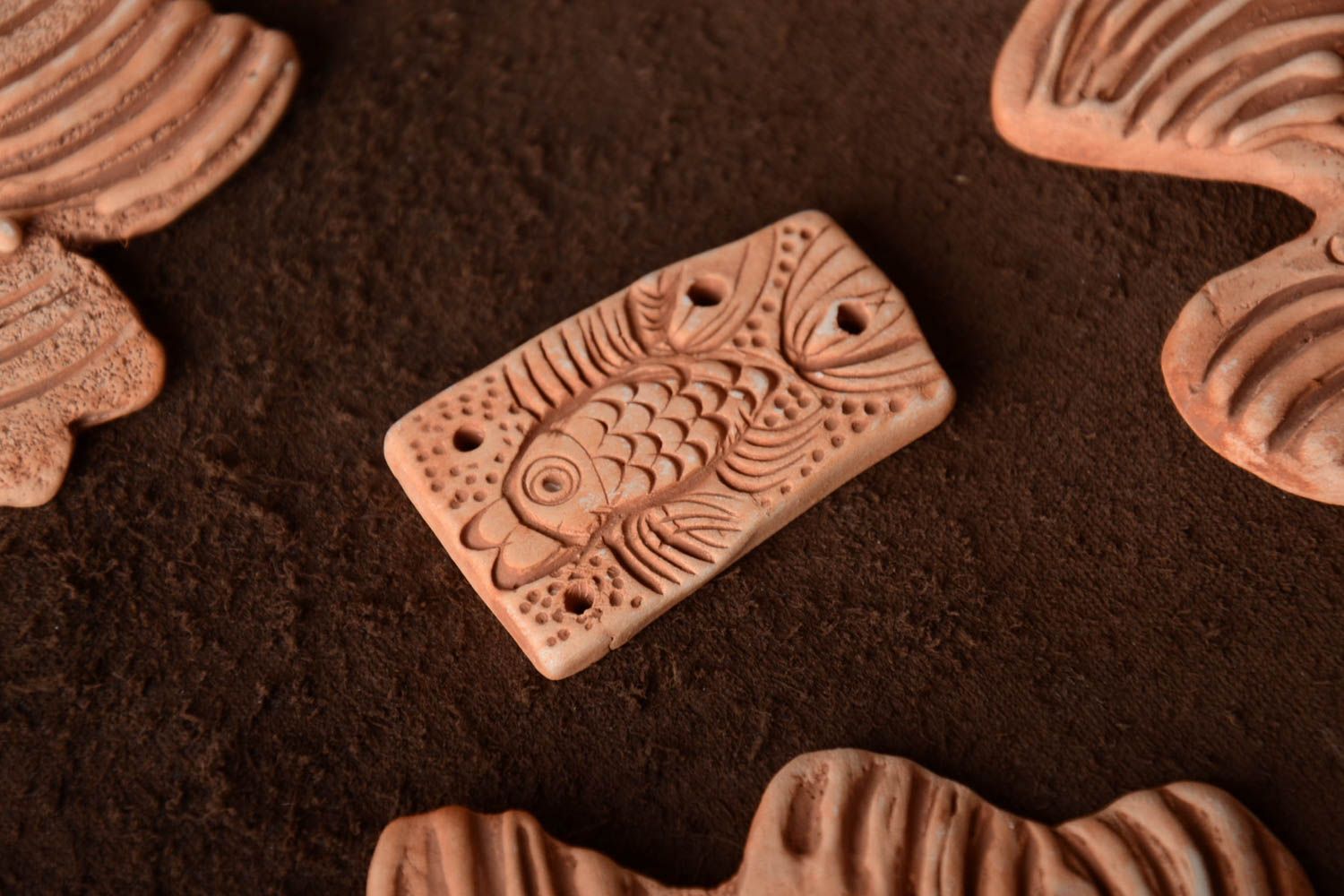 Handmade rectangular unpainted flat ceramic pendant with embossed fish pattern  photo 1