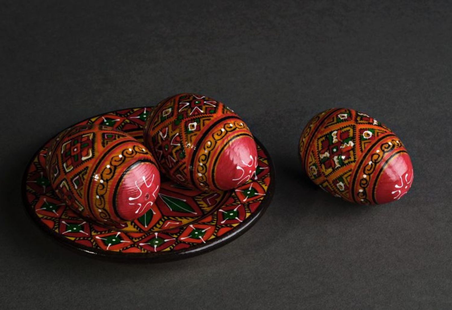 Wooden painted eggs on the plate photo 3