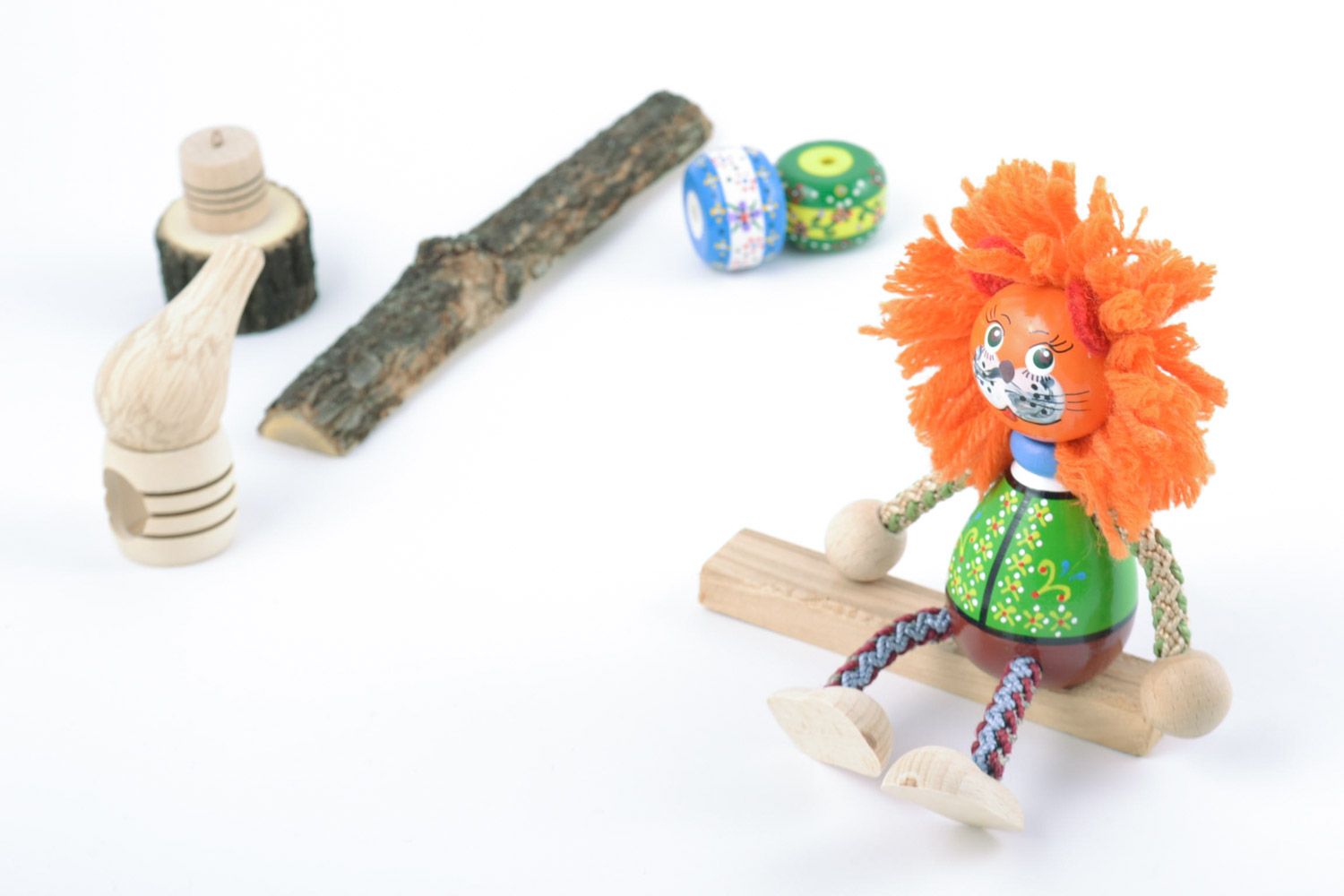 Unusual handmade beautiful wooden toy lion decorated with eco-paints present for children photo 1