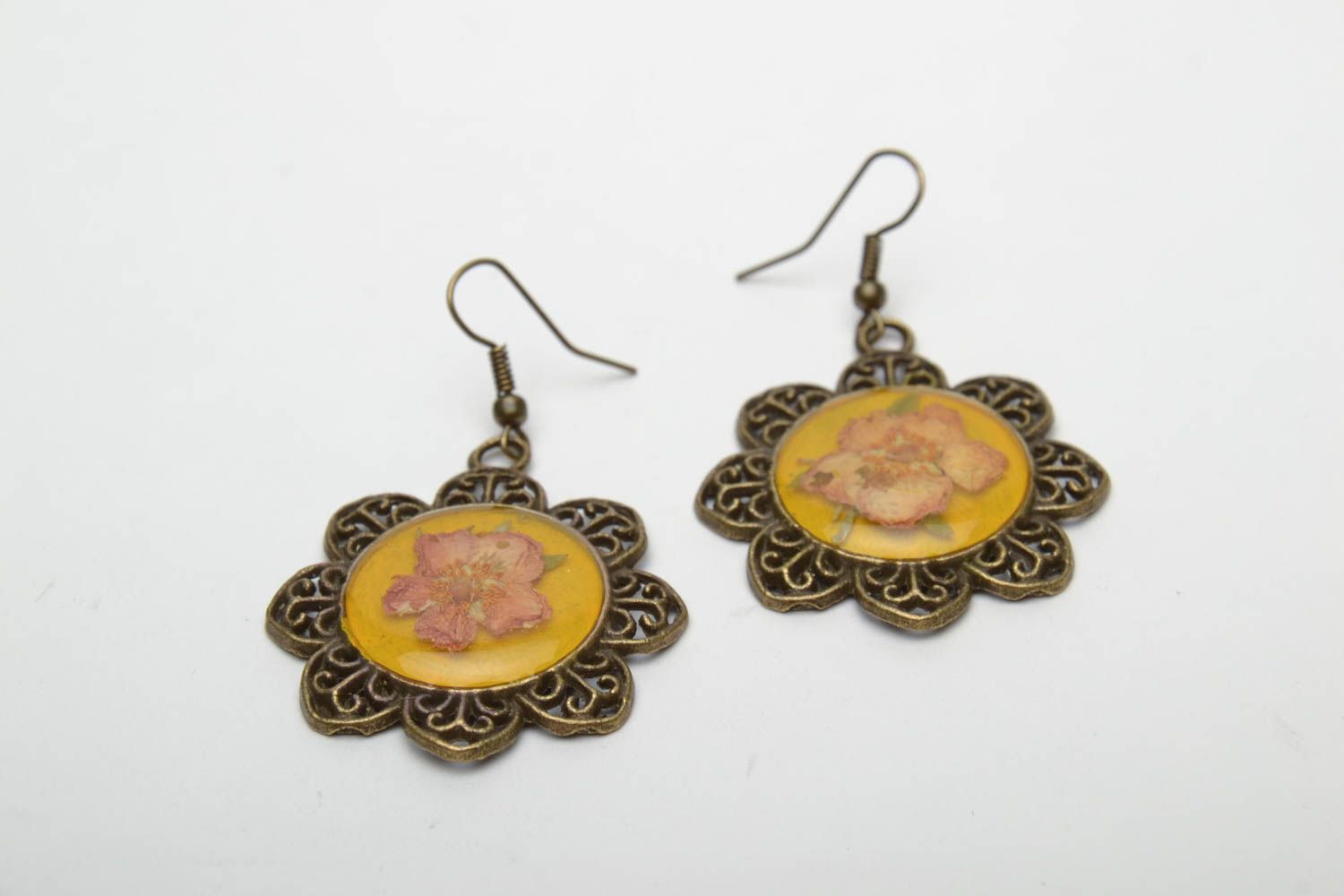 Unusual earrings with natural flowers in epoxy resin photo 3