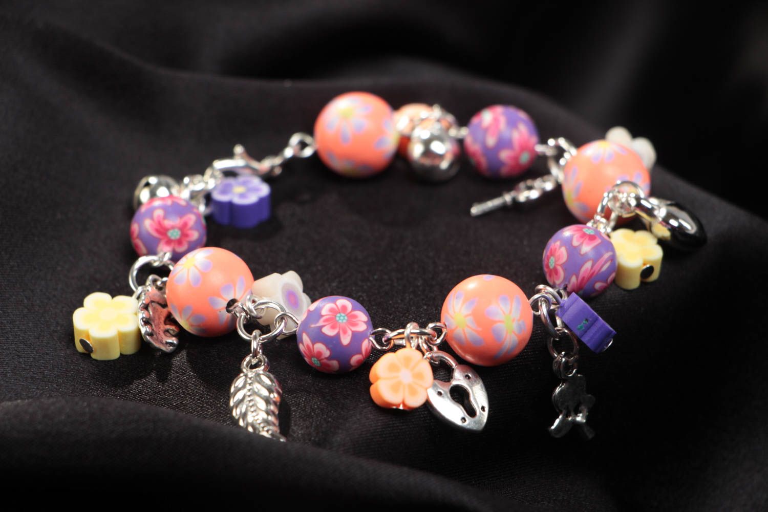 Unusual colorful handmade children's plastic wrist bracelet with charms photo 1