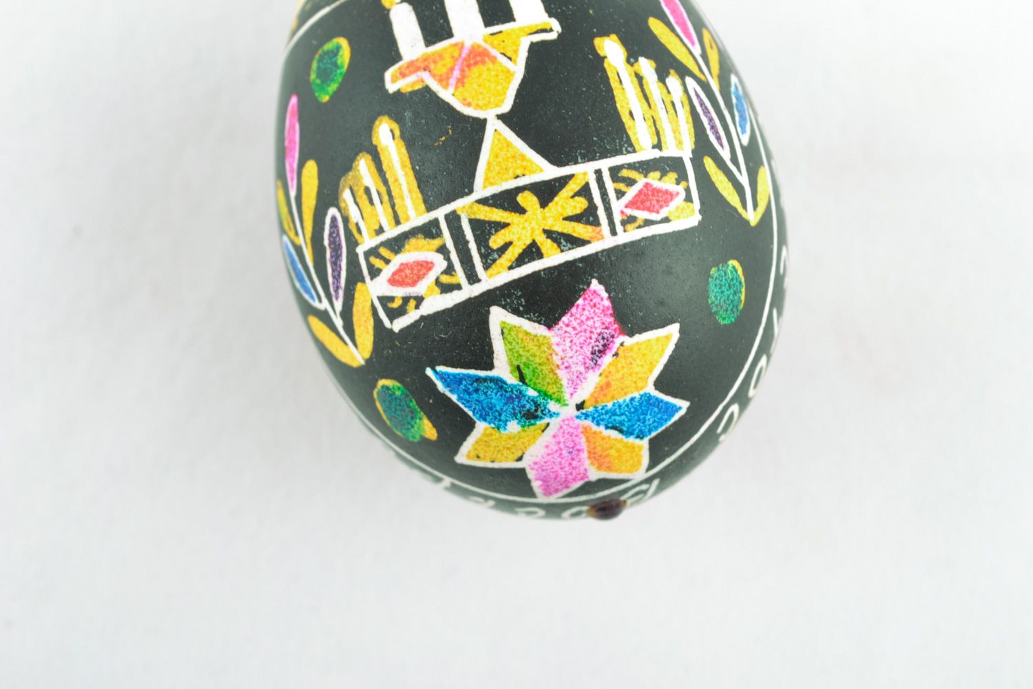 Handmade decorative egg with symbolic ornament painted using wax technique  photo 4
