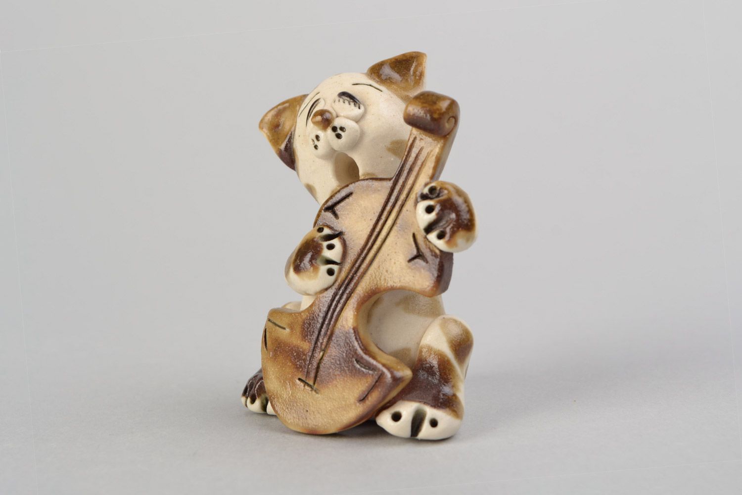 Handmade funny ceramic figurine of cat playing bass viol painted with glaze photo 1