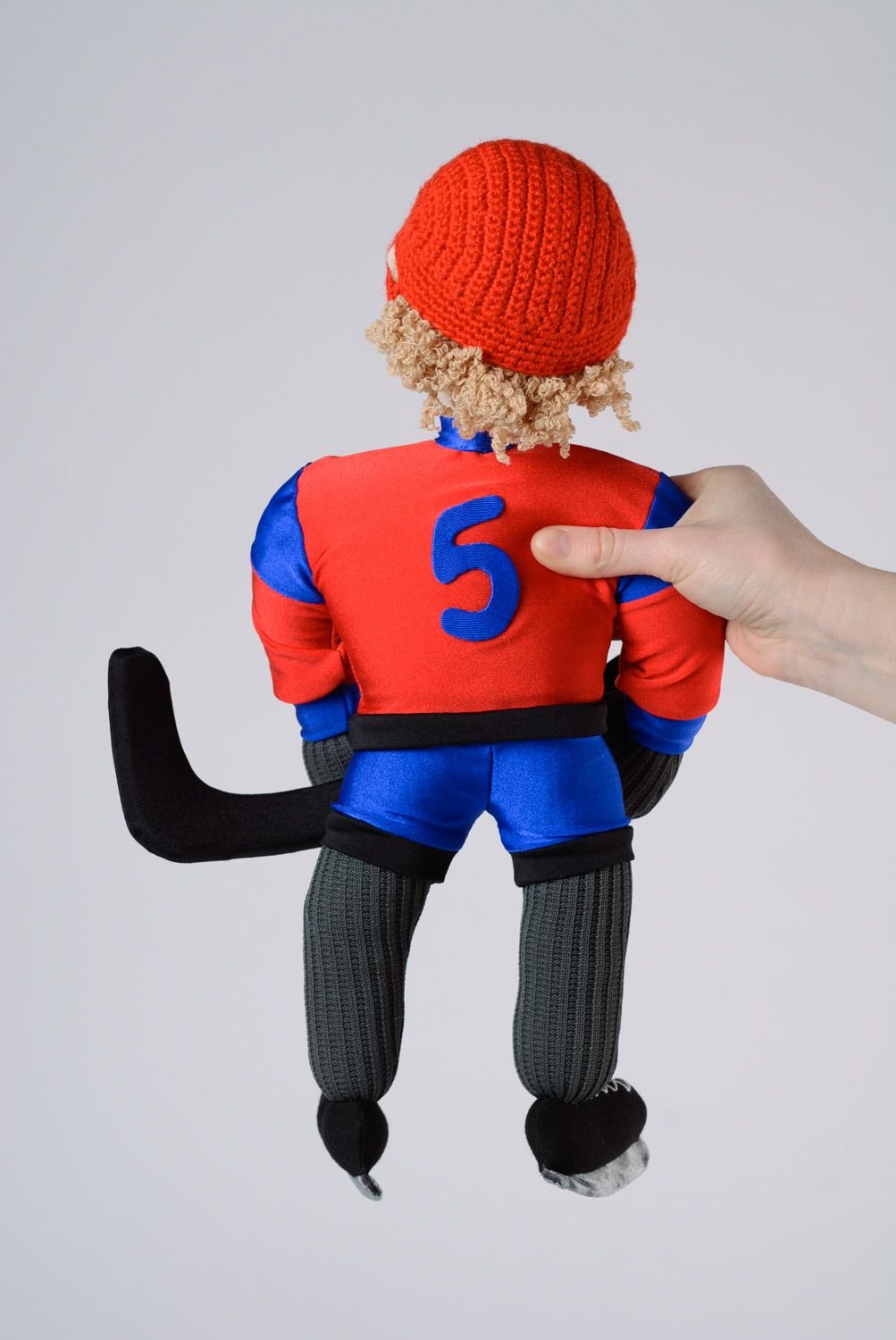 Funny handmade soft toy sewn of fabric in the shape of hockey player  photo 3