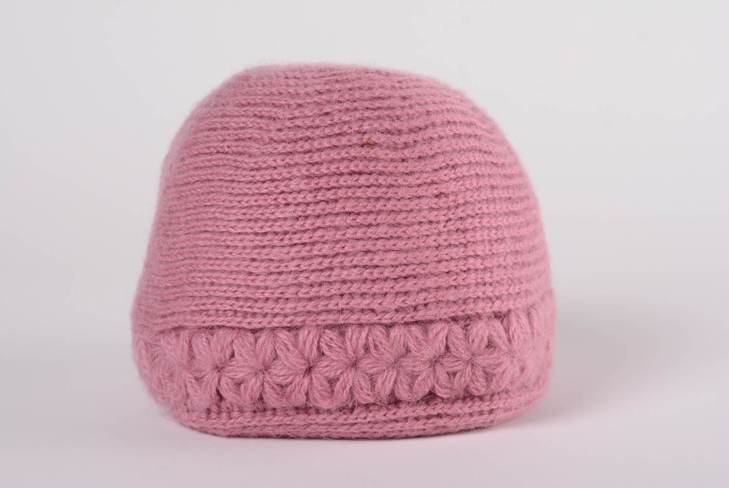 Handmade warm women's hat knitted of woolen threads of dark pink color photo 1