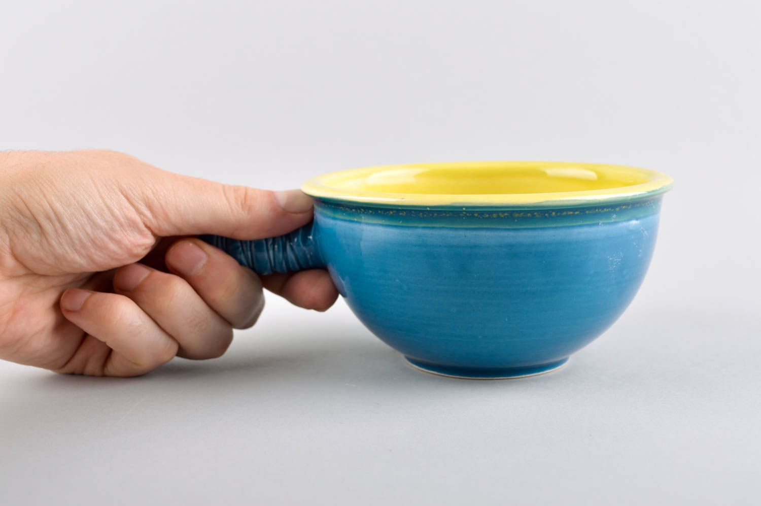 Ceramic blue and yellow color ceramic cup for kids with stick handle photo 5