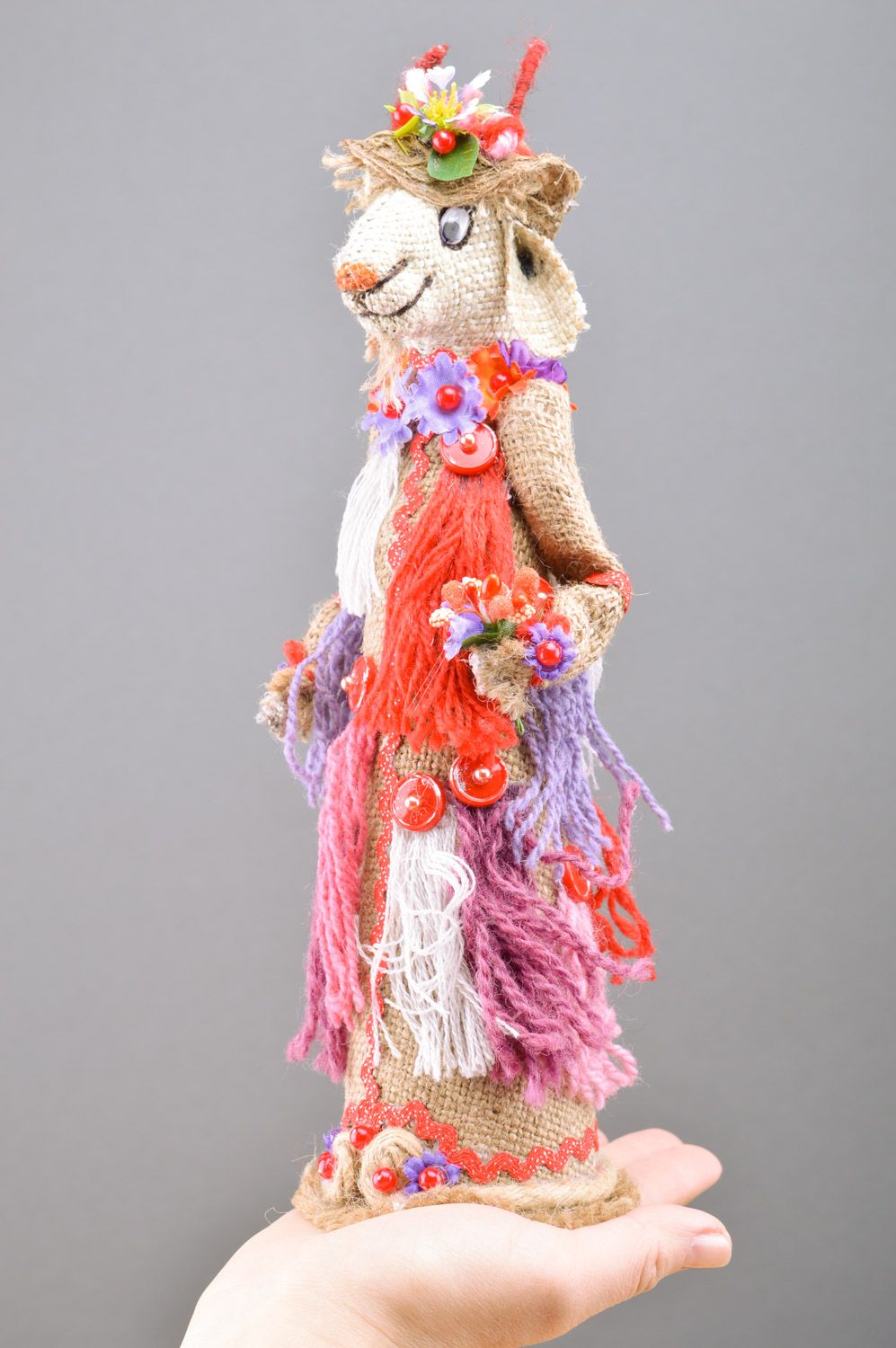 Handmade decorative bottle cozy sewn of burlap Goat in bright ethnic clothes photo 1