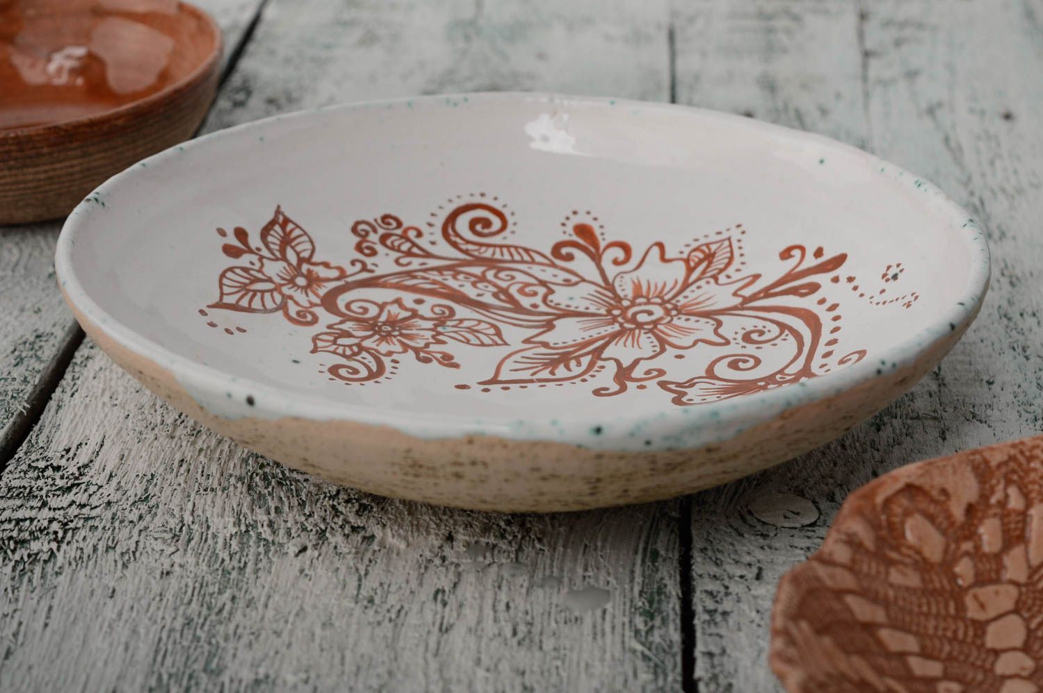 Painted ceramic plate with flowers photo 1