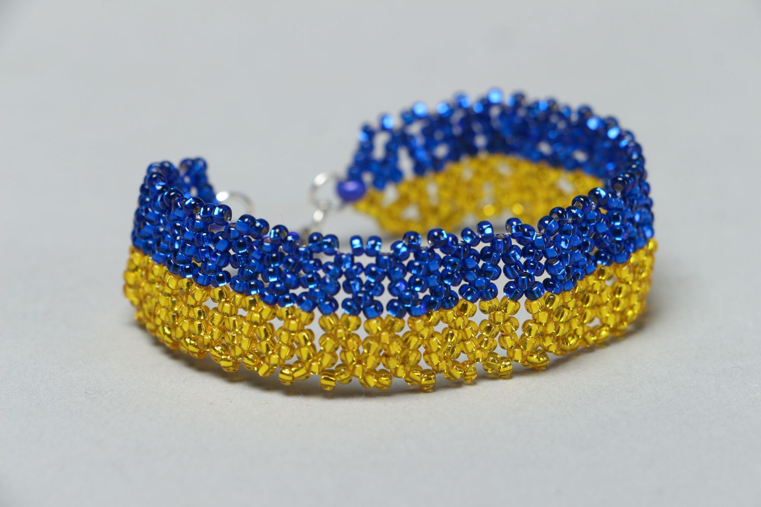 Handmade beaded bracelet in blue and yellow color  photo 1