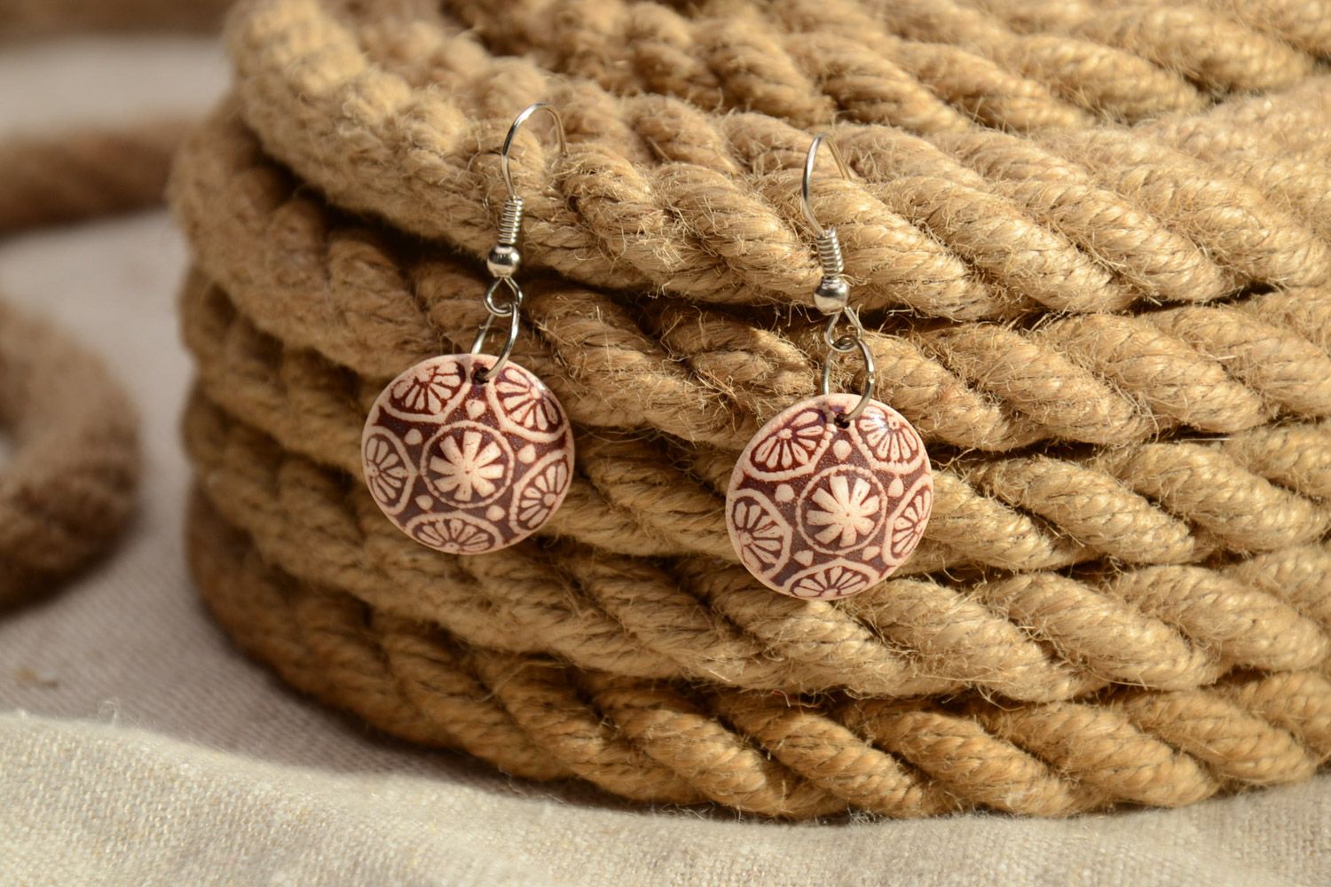 Handmade clay dangle round earrings of brown color with ornament  photo 1