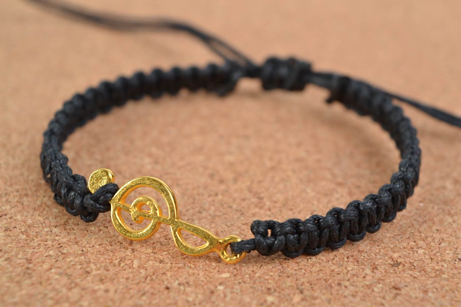 Handmade stylish bracelet made of cotton cord black with metal charm photo 1